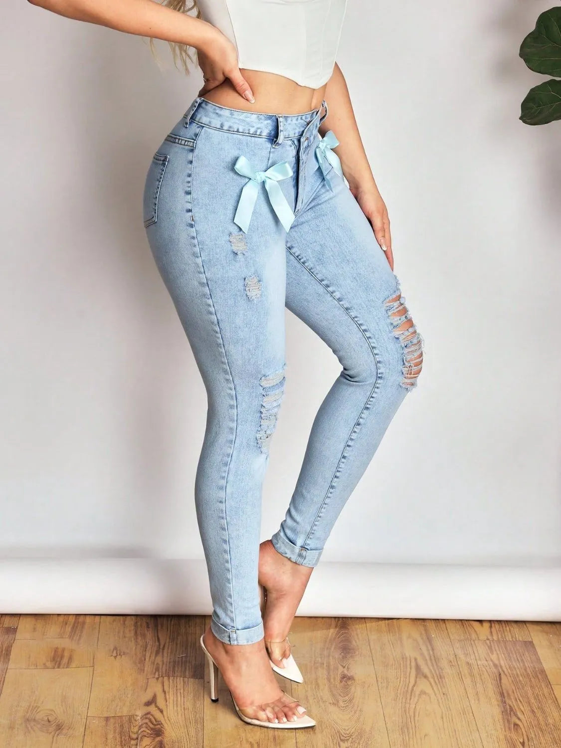 Bow Distressed Skinny Jeans