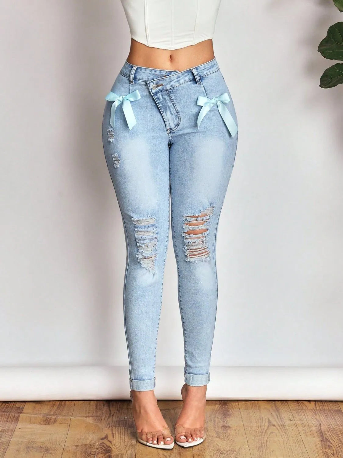 Bow Distressed Skinny Jeans